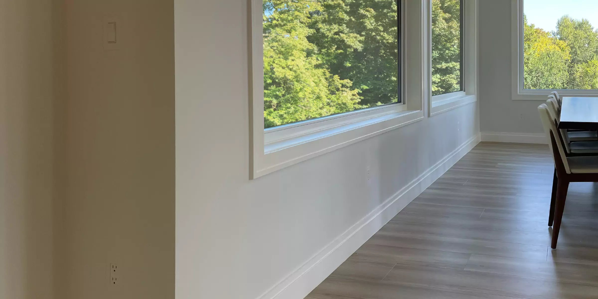 Modern dining room with large windows with CONCEAL flush-mounted switches & outlets blending in and barely visible
